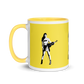 Yellow mug with various colors inside